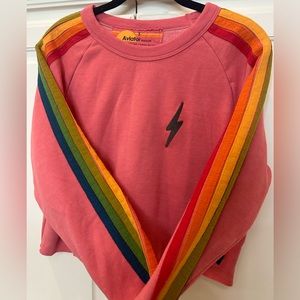 Aviator Nation Cropped with rainbow stripped sleeves and grey lightning bolt